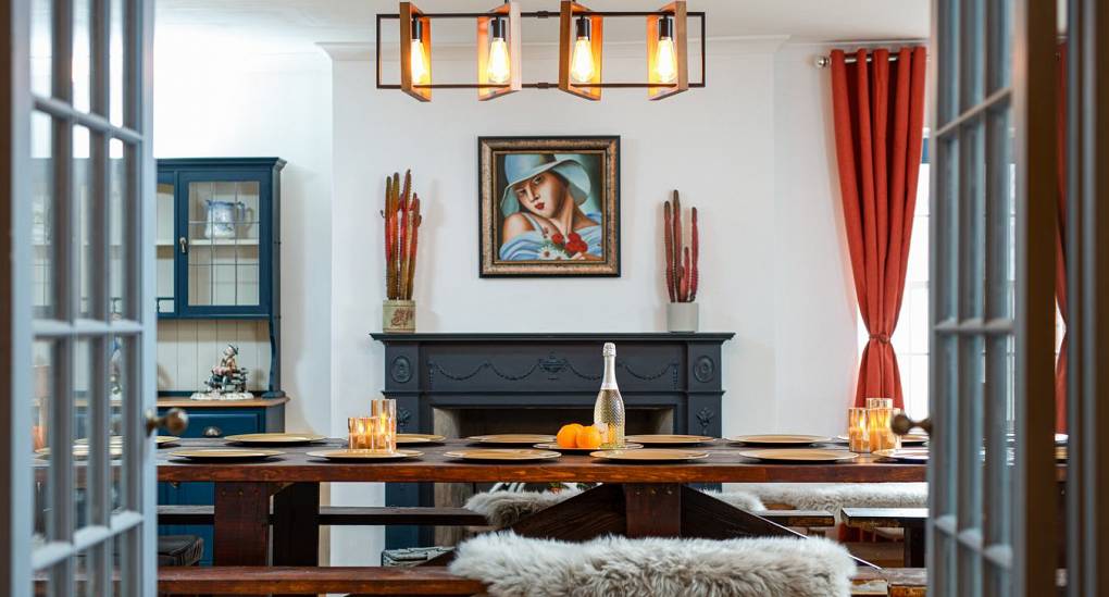 View of dining table through double doors