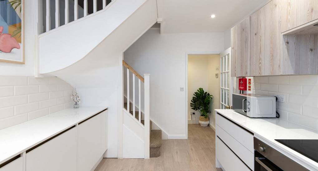 Kitchen leading to the stairs