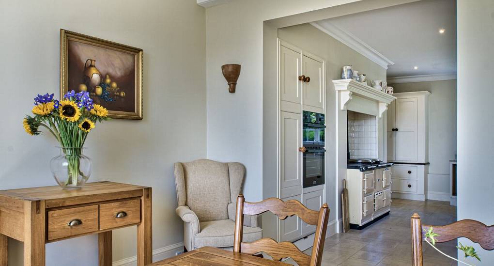 Breakfast table with view of kitchen