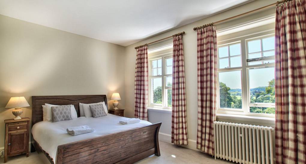 Double bedroom with checker curtains 