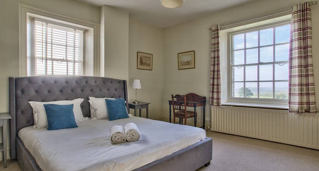 Queen size beds with 2 windows