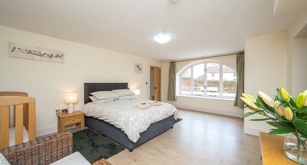 Large double bedroom with large bay window