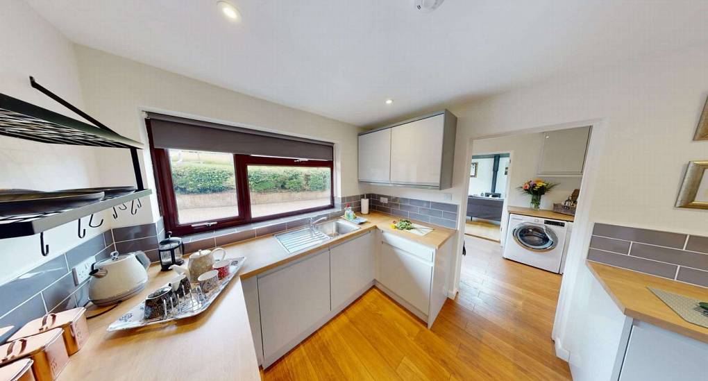 second kitchen with utility room