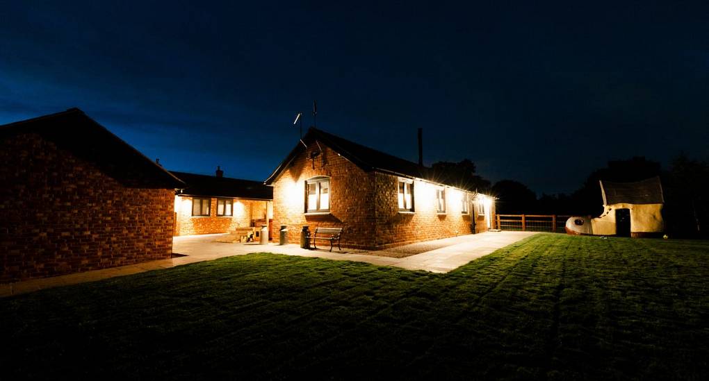 Stag and Hen Party Houses at night in garden