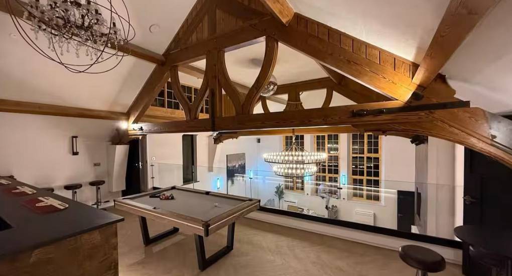 Built-in bar with stools and neon lighting at House of Dreams, the ultimate Chester party house.