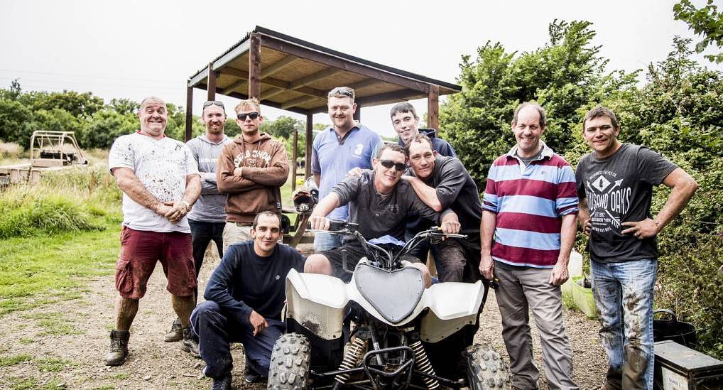 Group of stags posing for pic with quad bike