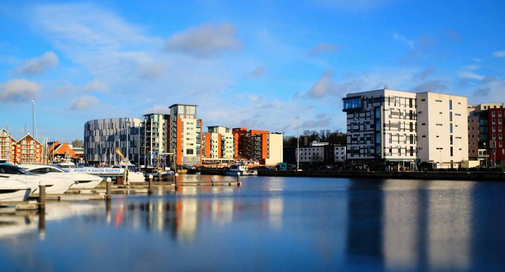 Modern Ipswich Waterfront marina and yachts reflecting on the water, vibrant setting for an Ipswich stag do.