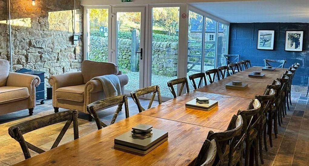 Social dining area at Lathkill Escape for large hen groups to enjoy communal meals in the Peak District.