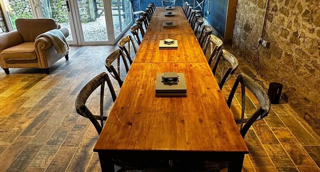 Detailed view of the large group dining table at Lathkill Escape luxury hen accommodation Peak District.