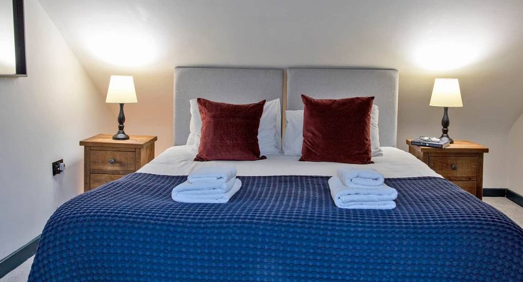 Flexible Super King bedroom at Lathkill Escape, one of five linked luxury cottages for hen parties.