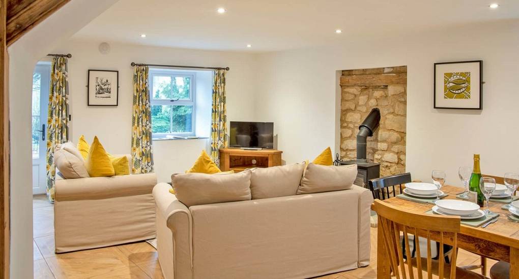 Spacious open-plan lounge and dining area for socialising during a Peak District hen weekend at Lathkill.