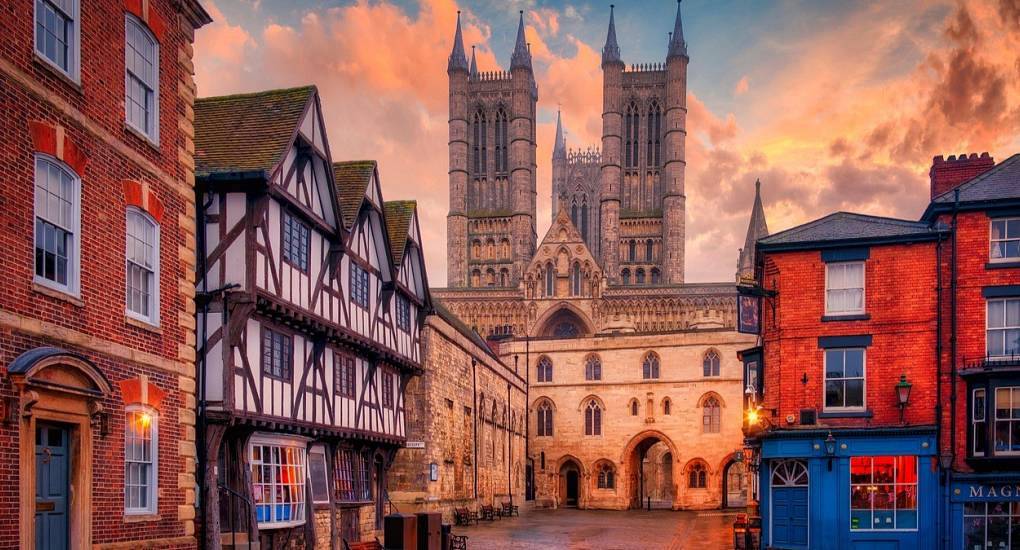 Lincoln Cathedral towers and Exchequer Gate at sunset, picturesque historic setting for a Lincoln hen party.