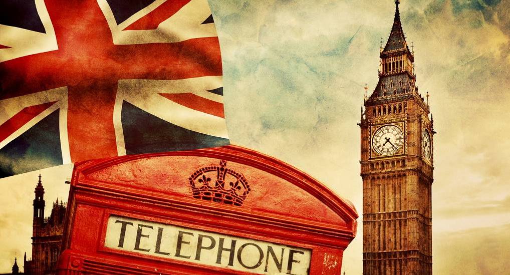 Iconic Big Ben Elizabeth Tower, Union Jack flag, and red telephone kiosk in central London, ideal for a London stag do.