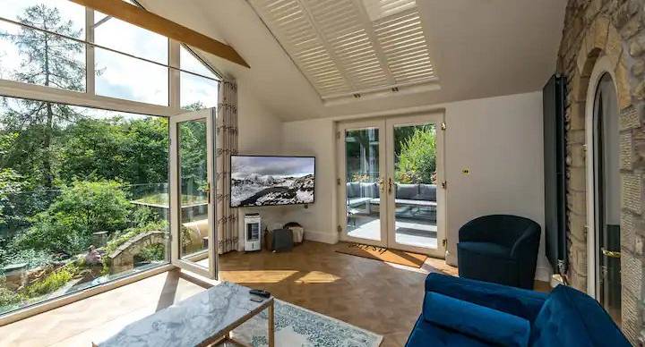 Bright lounge area with door open into the courtyard area