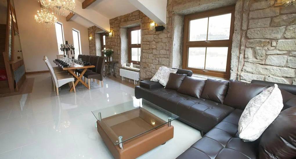 Open plan area with sofas and the large dining table