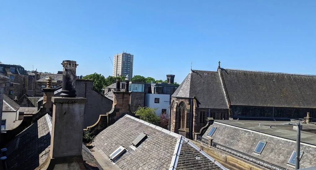 Stunning rooftop view of the Edinburgh skyline from the Lux Life private terrace, providing an exclusive backdrop for luxury city centre hen parties and stag weekends.