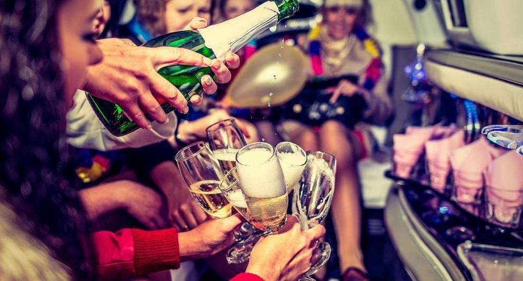 Sweet and Stylish Malta hen weekend package. Hens enjoying a drink in the Limo