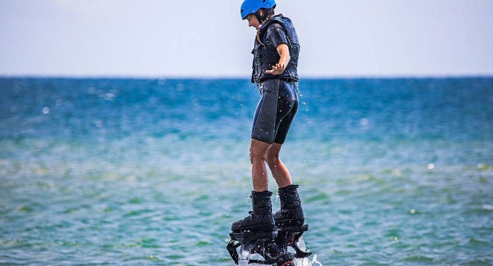 Young woman Flyboarding 
