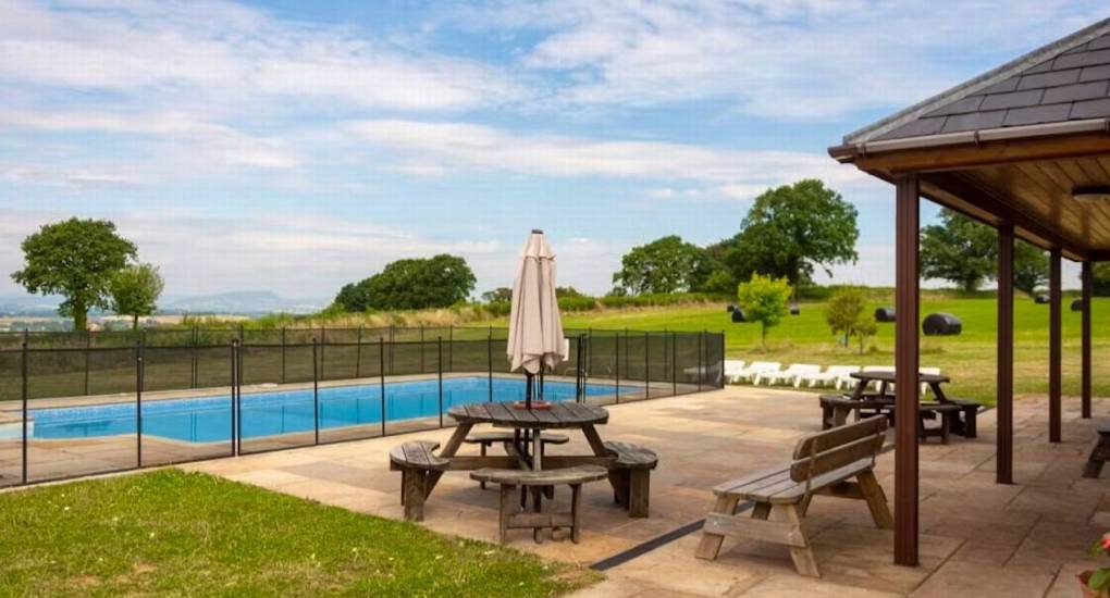 Monmouthshire party cottage Horizon View garden with furniture and pool