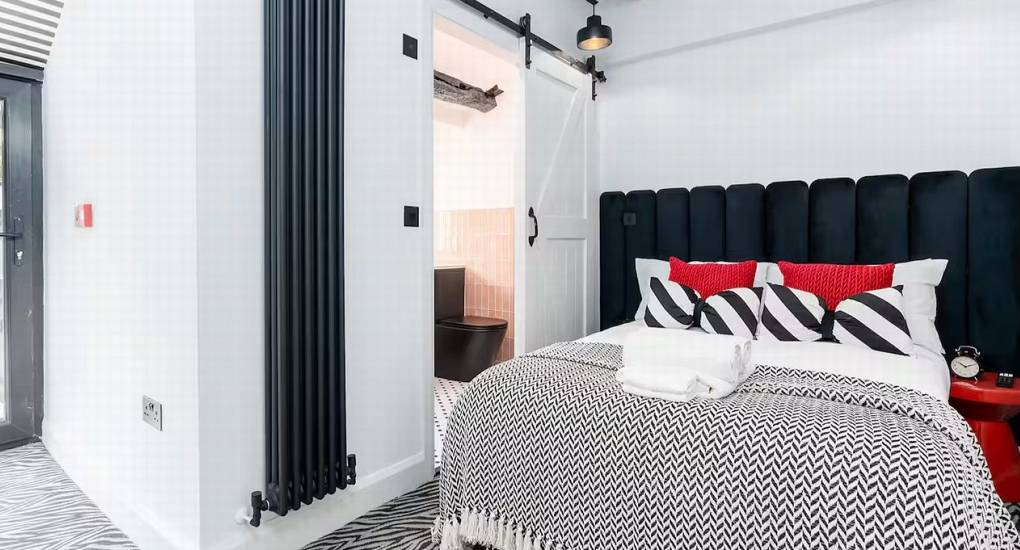 Double bedroom 2 looking through to the private en-suite bathroom for hen party guests