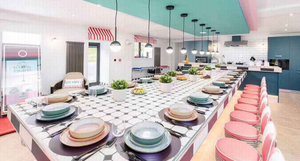 Elevated view of the long, diner-style dining table and swivel chairs at the Mountaintop Marvel Lake District hen house