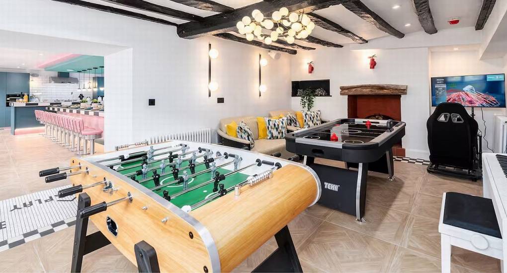 Table football (foosball) in the fun Games Room at the Lake District party house