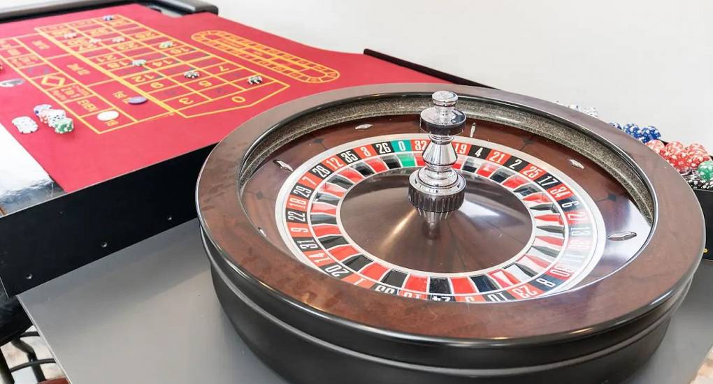 Full-sized roulette wheel inside the private casino room at the Lake District party house