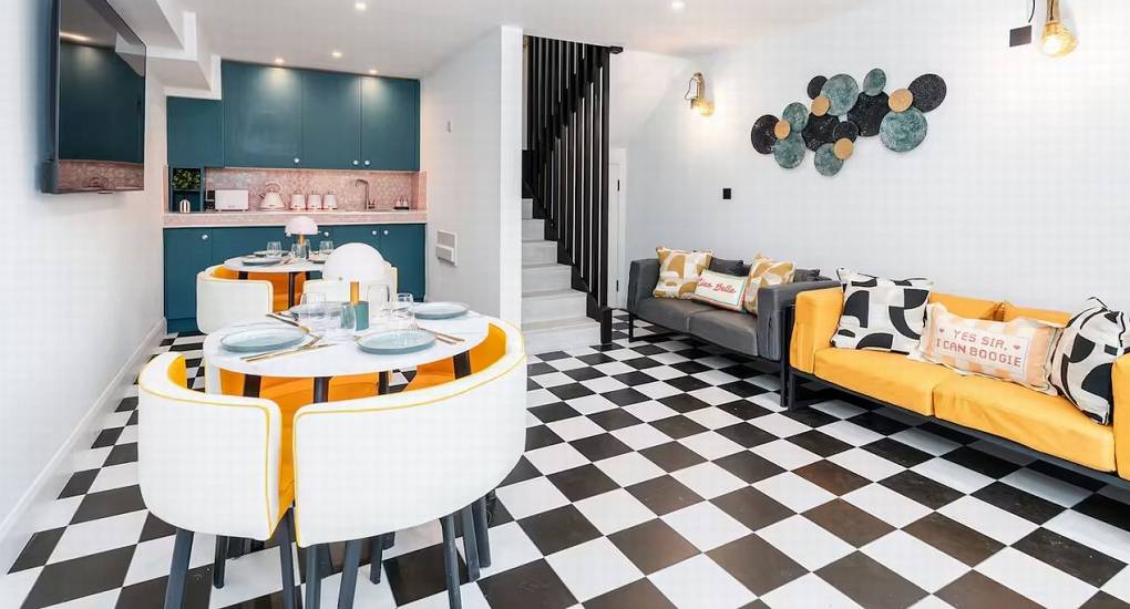 Stylish, retro-themed chill-out lounge area with comfortable seating at Mountaintop Marvel Lake District hen do accommodation