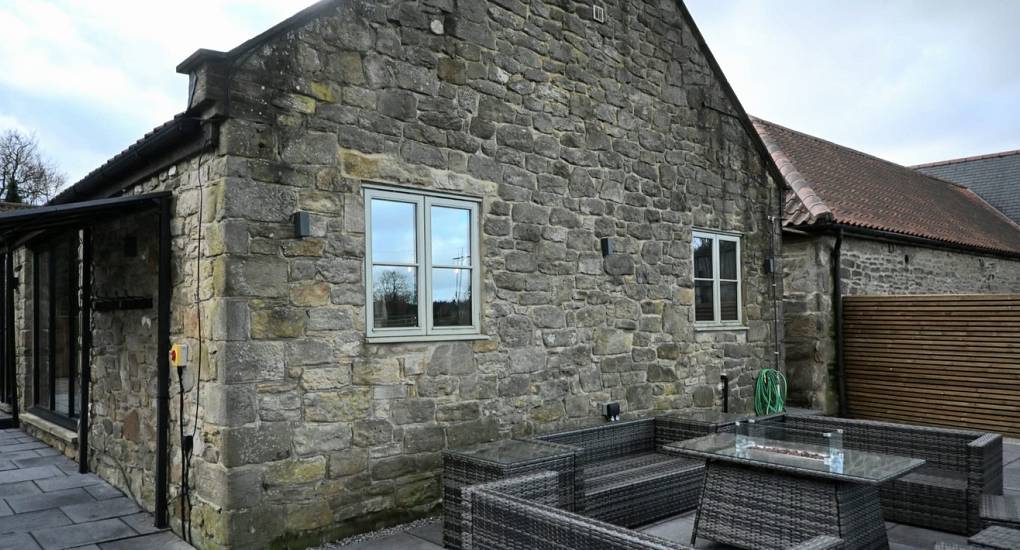Outdoor social seating area at Geordie Getaway 26, a high-capacity Newcastle hen party house designed for large group celebrations.