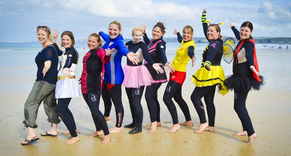 Hen parties in Newquay. Hen group pose on the beach