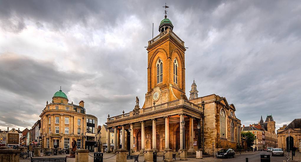 All Saints Church portico and clock tower in Northampton town centre, historic backdrop for a Northampton stag do.