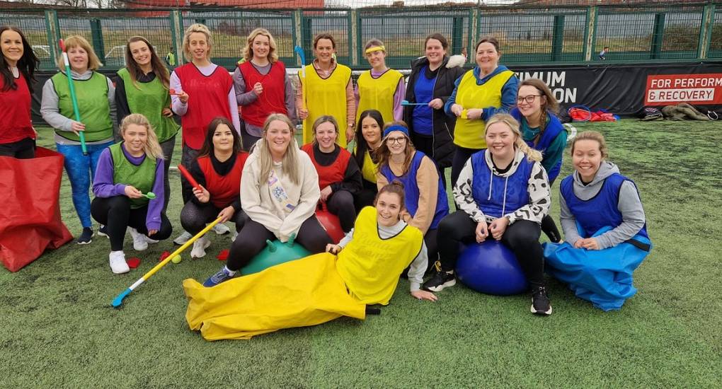 Hen party posing with some old school sports day props