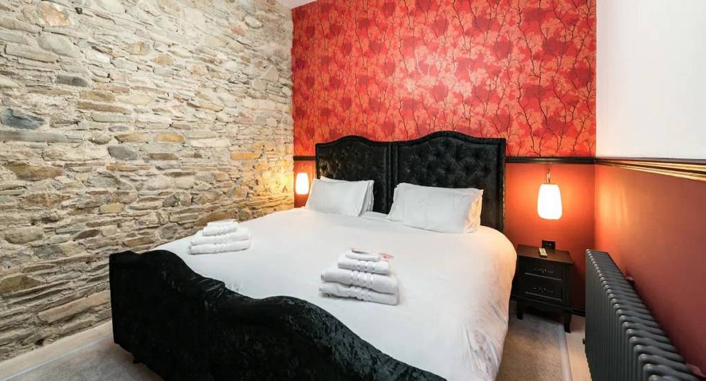 One of the eight bedrooms at the Grand Hall Party House in the Lake District