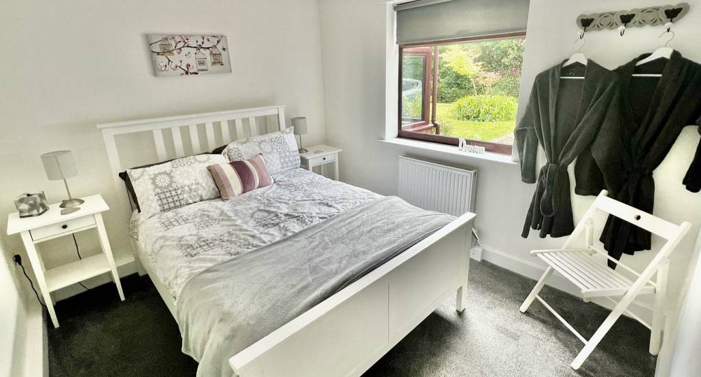 Double bedroom and bath robes at the Forest Tree House