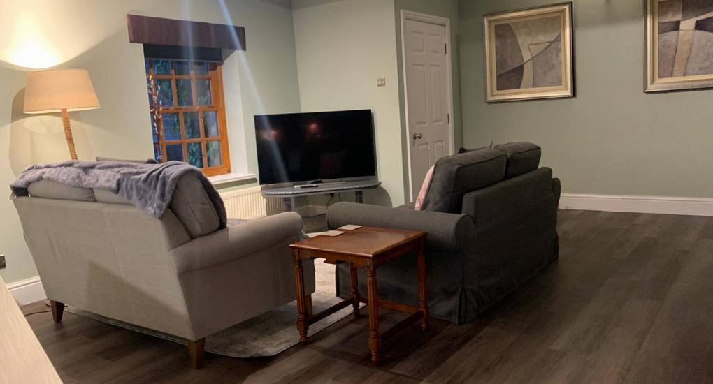 Lounge area with sofas and tv