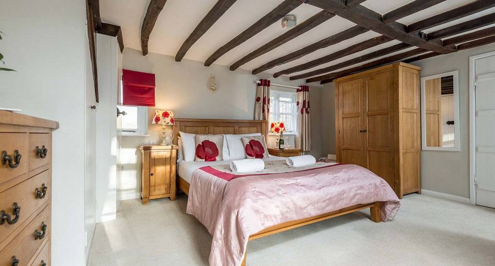 One of the spacious bedrooms in the Secret Garden New Forest hen do party house