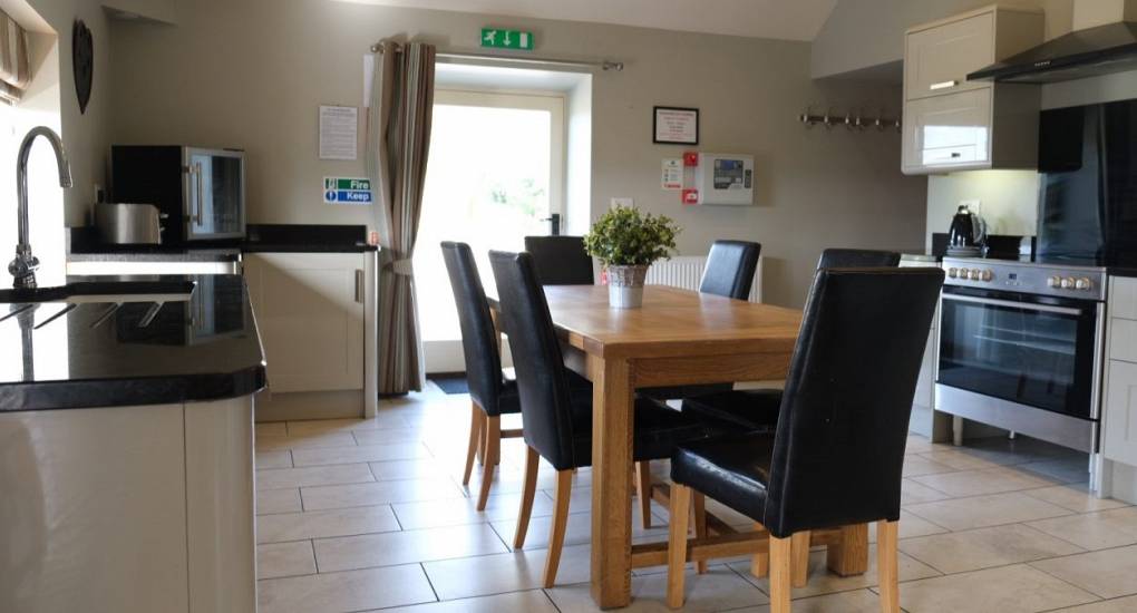 Open plan kitchen with dining table 