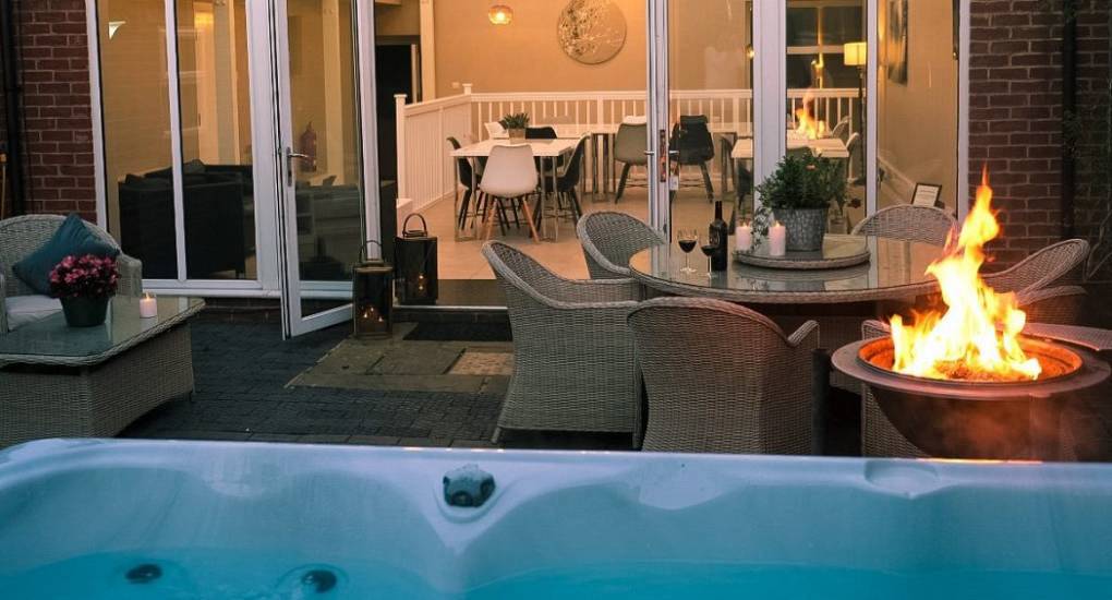 The Swan: Historic party house with 10 bedrooms, modern kitchen bar area, and air hockey games room.