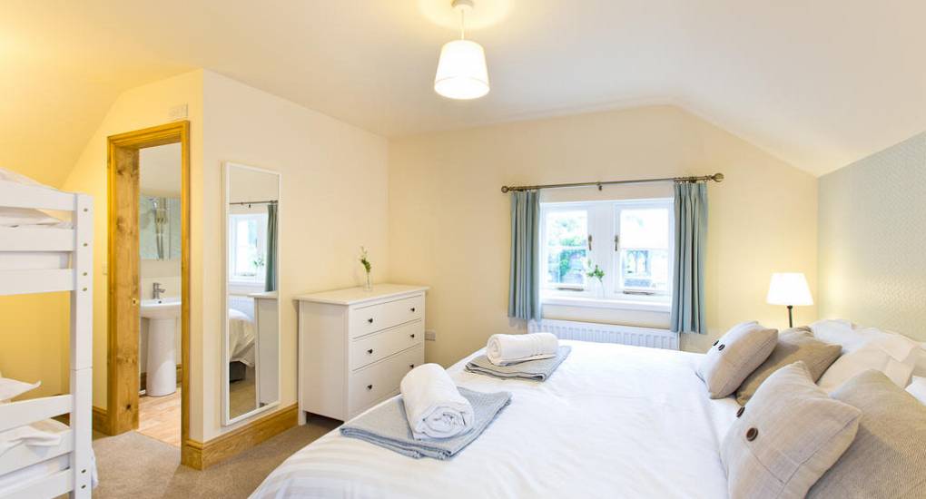 Bedroom one at Peak Star: A well-appointed double room offering a comfortable stay for a Peak District hen do weekend.