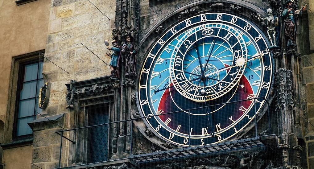 Prague Astronomical Clock dial and gothic details on Old Town Hall, iconic landmark backdrop for a Prague hen do.