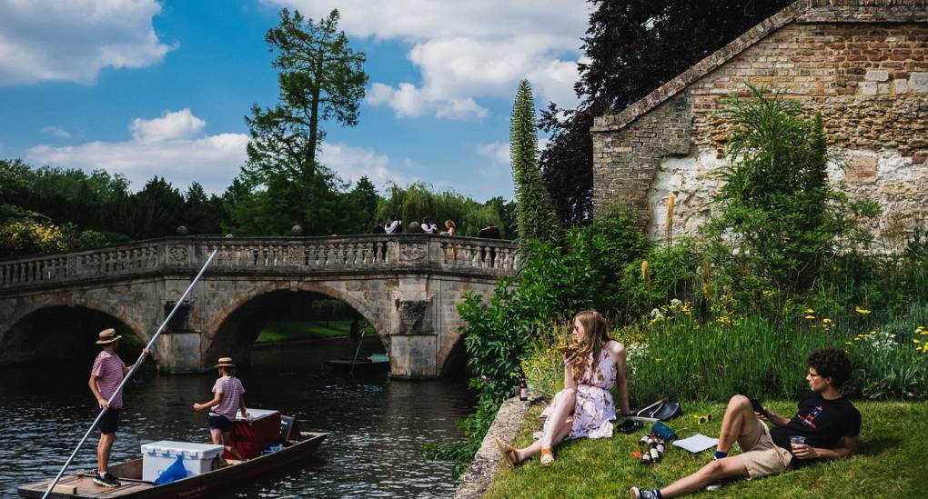 Young couple enjoying the scenery whilst watching punting