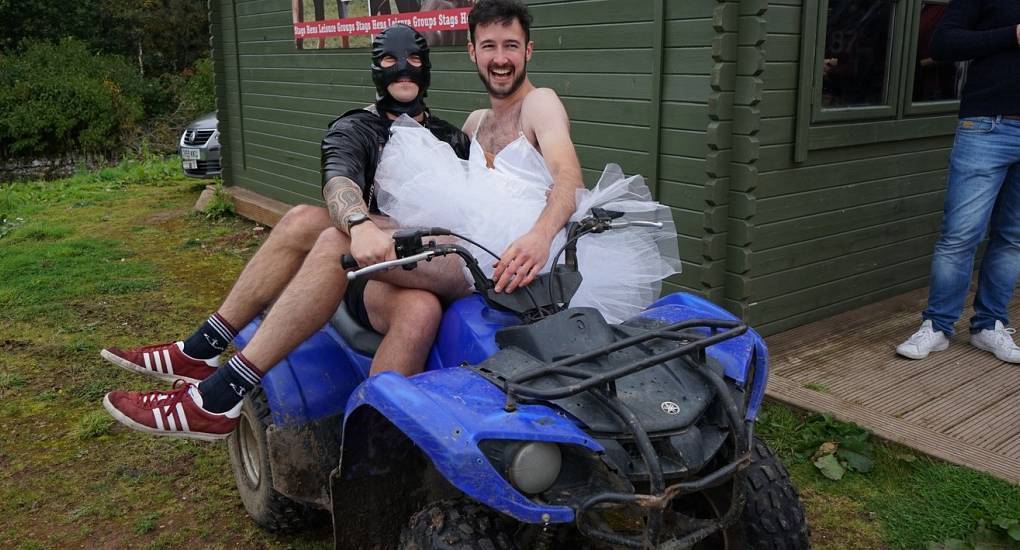 Stag do in fancy dress gets carried on a quad bike