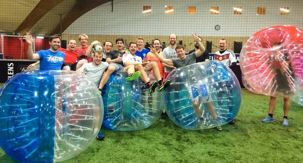 Group of stags enjoying Zorb Football on a Hamburg Stag Do