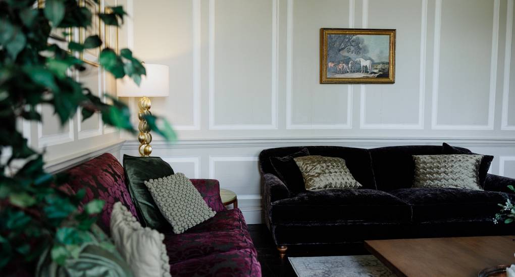 Regal Manor two luxury party house lounge area showing two sofas