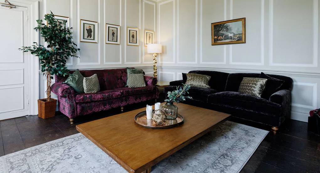 Two luxury sofas in the lounge at the Regal Manor two luxury party house