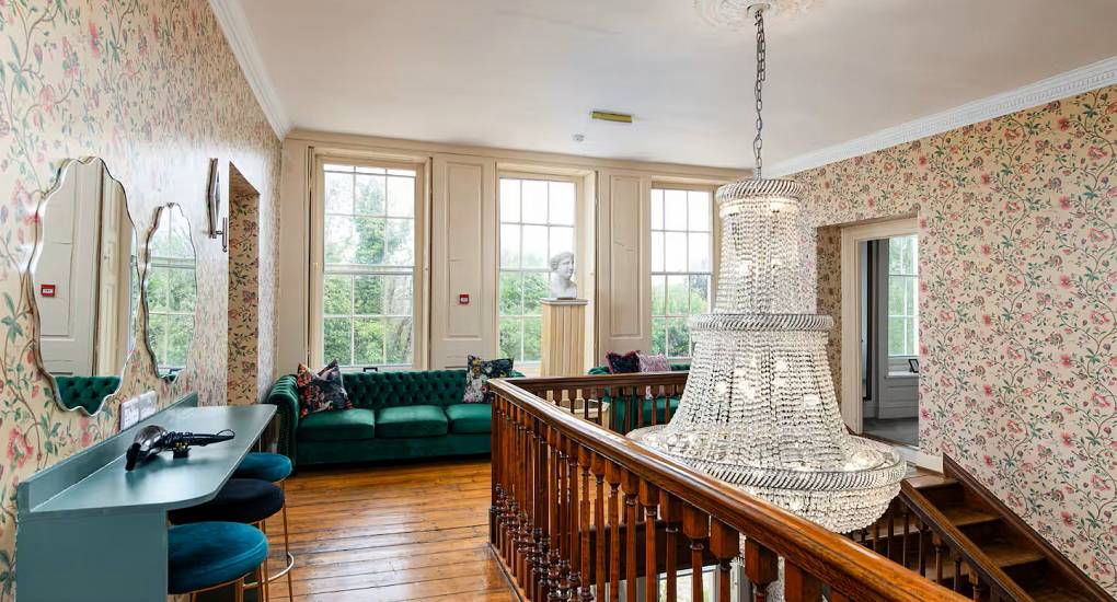 Dressing table and seating in the hallway at the Regal Manor two luxury party house