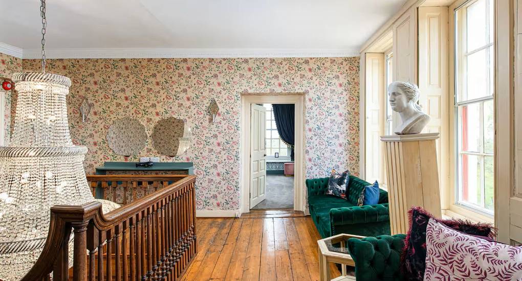 Chandelier hanging in the hallway at the Regal Manor two luxury party house 