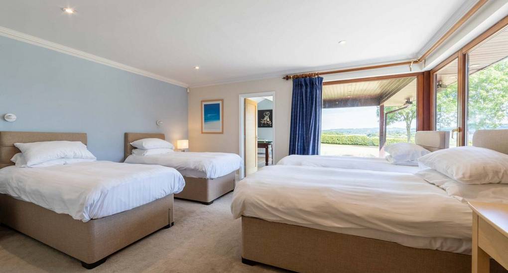 Quad bedroom in Retreat 20 that leads through to the games room
