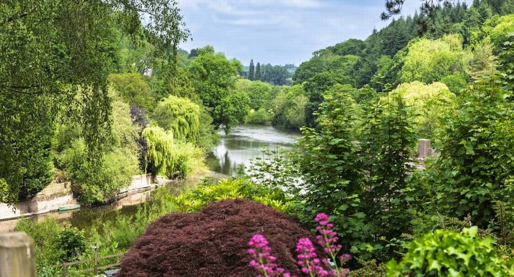 A scenic view of the River Wye from the garden of River View Lodge, a perfect Herefordshire hen party house with outdoor space.