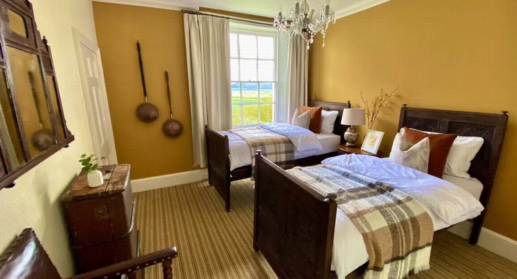 A beautifully decorated twin bedroom at Rivers Countryside Mansion, perfect for hen weekend accommodation.